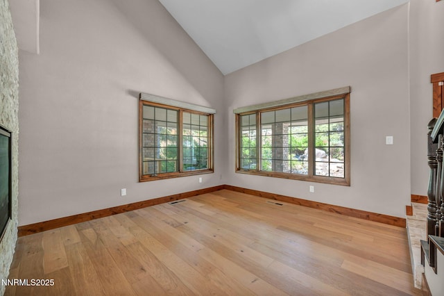 4215 Wild Eagle Ter, Reno, NV 89511 - unfurnished living room with hardwood / wood-style flooring and high vaulted ceiling