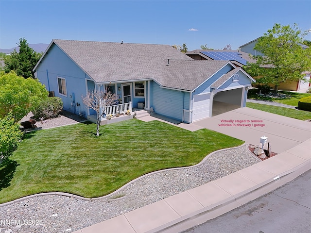 8490 Coral Reef Dr, Reno, NV 89506 - ranch-style home featuring a porch, an attached garage, concrete driveway, a front yard, and roof with shingles