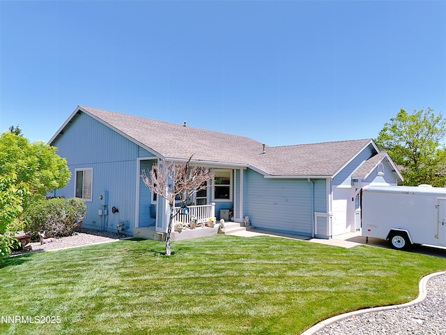 8490 Coral Reef Dr, Reno, NV 89506 - view of front facade with a porch, a front lawn, and a shingled roof