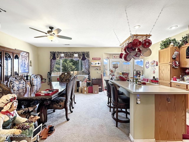 8490 Coral Reef Dr, Reno, NV 89506 - dining room with light colored carpet and a ceiling fan
