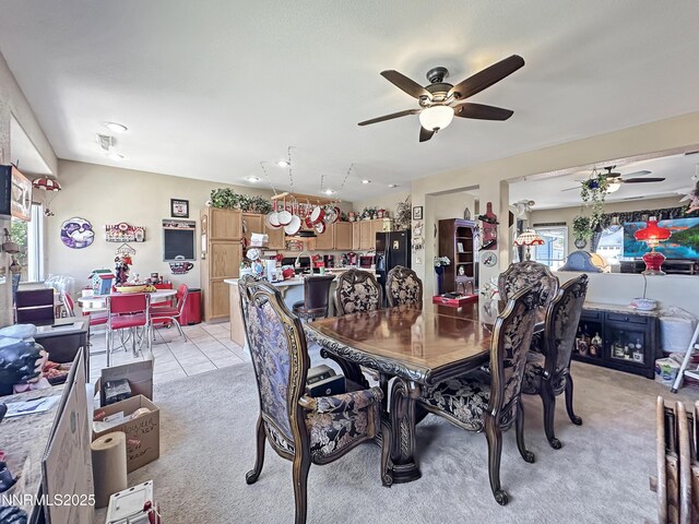 8490 Coral Reef Dr, Reno, NV 89506 - dining area with a ceiling fan, light carpet, and plenty of natural light