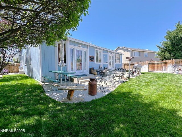 8490 Coral Reef Dr, Reno, NV 89506 - back of property with a patio area and french doors