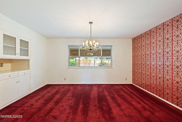 1495 Lillian Way, Reno, NV 89509 - unfurnished dining area with a chandelier, baseboards, and carpet flooring