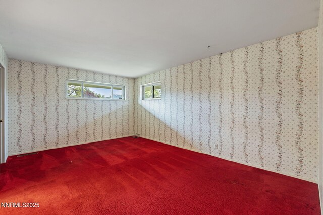 1495 Lillian Way, Reno, NV 89509 - empty room featuring wallpapered walls and dark colored carpet