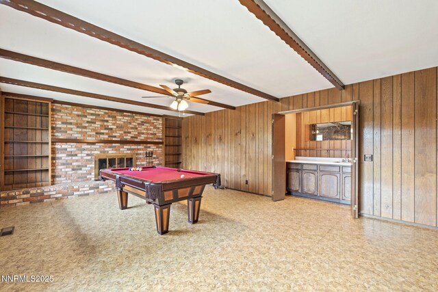 1495 Lillian Way, Reno, NV 89509 - recreation room featuring beamed ceiling, wood walls, a brick fireplace, billiards table, and ceiling fan