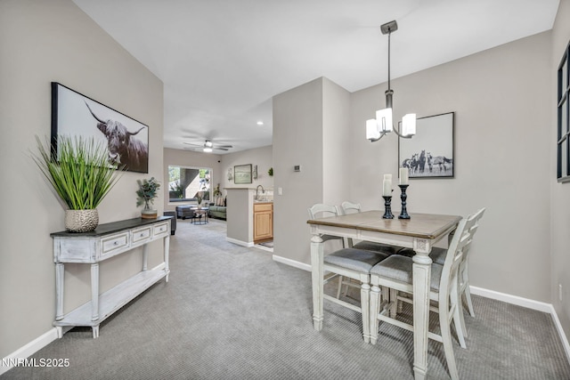 900 S Meadows Pkwy Unit 2623, Reno, NV 89521 - dining area with light colored carpet, baseboards, a chandelier, and recessed lighting