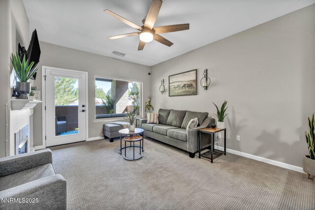 900 S Meadows Pkwy Unit 2623, Reno, NV 89521 - living room featuring carpet flooring, a ceiling fan, baseboards, and a glass covered fireplace