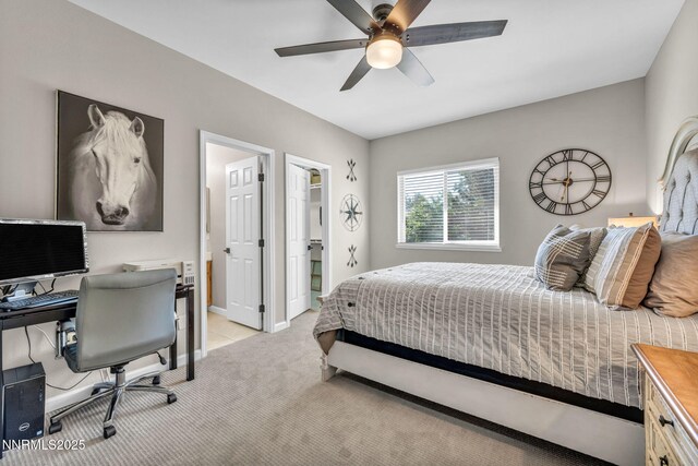900 S Meadows Pkwy Unit 2623, Reno, NV 89521 - bedroom with light carpet, a desk, a ceiling fan, a spacious closet, and baseboards