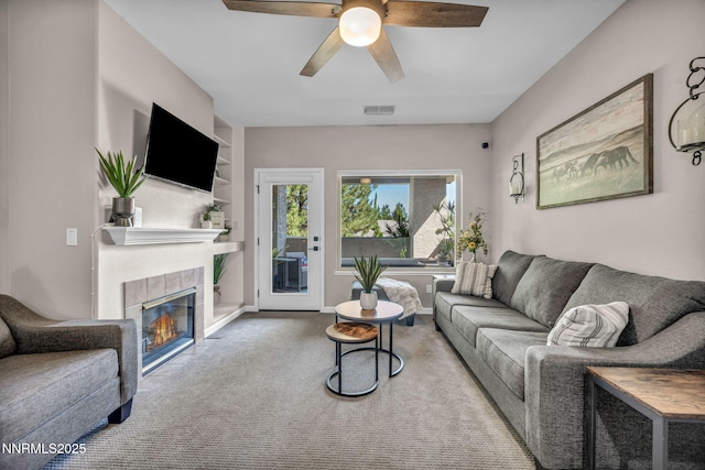 900 S Meadows Pkwy Unit 2623, Reno, NV 89521 - carpeted living room featuring ceiling fan, a fireplace, and built in features