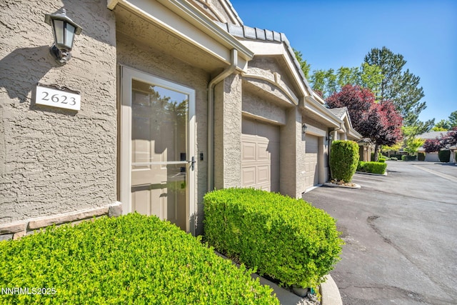 900 S Meadows Pkwy Unit 2623, Reno, NV 89521 - entrance to property with a garage and driveway