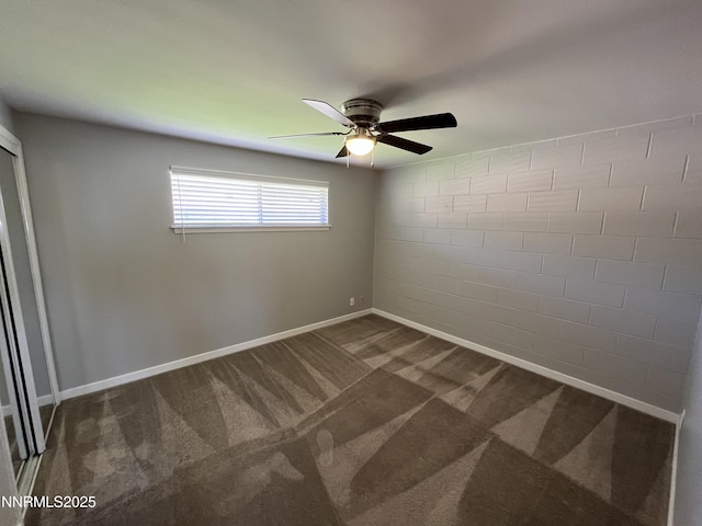 1140 S Curry St, Carson City, NV 89703 - spare room featuring ceiling fan, dark carpet, and baseboards