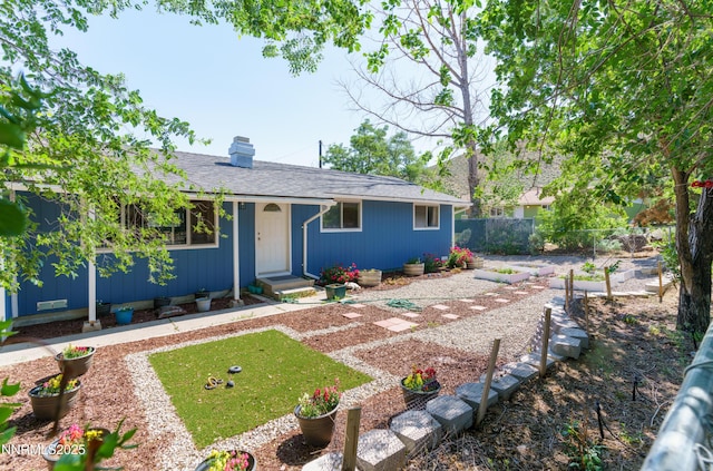 8725 Paloma Way, Reno, NV 89506 - single story home with a chimney, entry steps, and roof with shingles