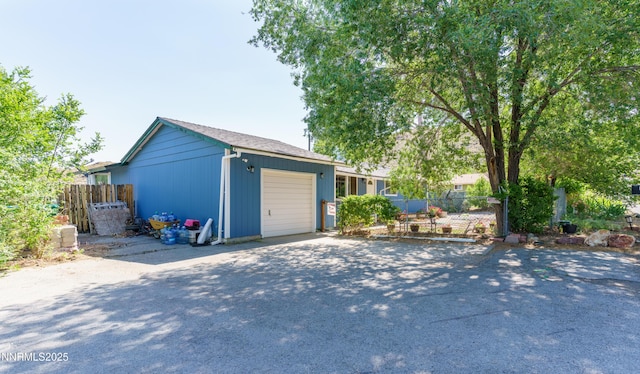 8725 Paloma Way, Reno, NV 89506 - garage featuring asphalt driveway