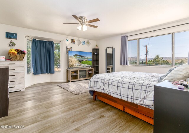 8725 Paloma Way, Reno, NV 89506 - bedroom featuring wood finished floors, baseboards, and a ceiling fan