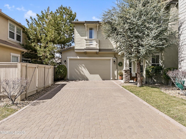 7693 Stone Bluff Way, Reno, NV 89523 - view of front of home with an attached garage, decorative driveway, and stucco siding