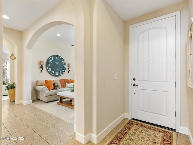 7693 Stone Bluff Way, Reno, NV 89523 - foyer entrance with arched walkways, light tile patterned flooring, baseboards, and recessed lighting
