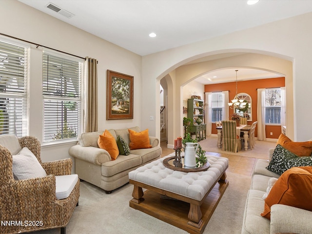 7693 Stone Bluff Way, Reno, NV 89523 - living area featuring arched walkways, recessed lighting, a chandelier, and baseboards