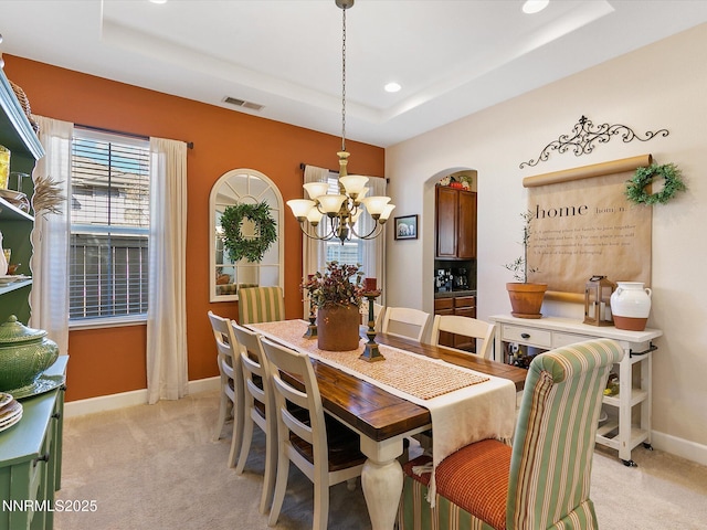 7693 Stone Bluff Way, Reno, NV 89523 - dining room with a chandelier, light carpet, a tray ceiling, recessed lighting, and baseboards