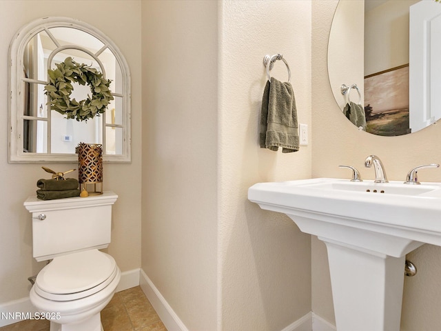 7693 Stone Bluff Way, Reno, NV 89523 - bathroom featuring toilet and baseboards