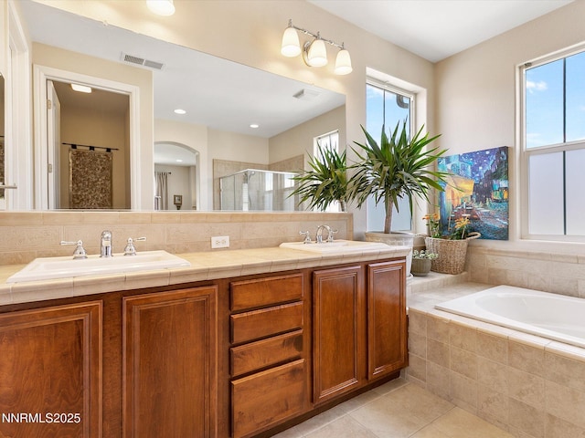 7693 Stone Bluff Way, Reno, NV 89523 - full bath with a shower stall, double vanity, tile patterned flooring, and a bath