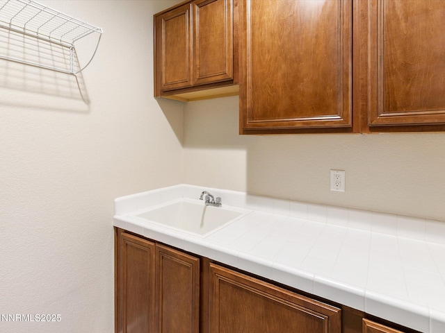 7693 Stone Bluff Way, Reno, NV 89523 - laundry area with a sink