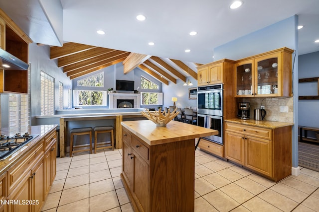 1314 Saint Gallen Ct, Incline Village, NV 89451 - kitchen featuring stainless steel appliances, wood counters, backsplash, recessed lighting, and glass insert cabinets