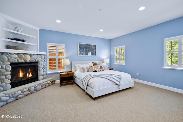 1314 Saint Gallen Ct, Incline Village, NV 89451 - carpeted bedroom with a stone fireplace, recessed lighting, and baseboards