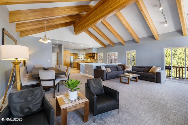 1314 Saint Gallen Ct, Incline Village, NV 89451 - living room featuring light colored carpet, beam ceiling, recessed lighting, rail lighting, and high vaulted ceiling