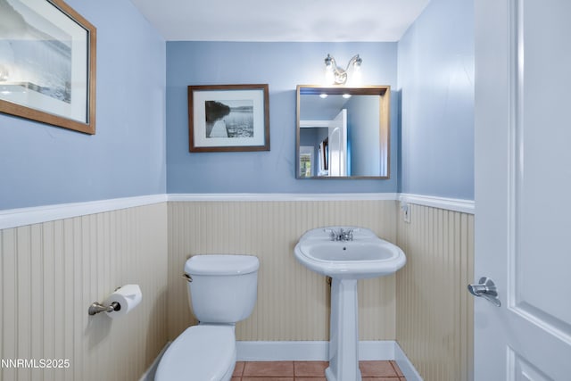 1314 Saint Gallen Ct, Incline Village, NV 89451 - bathroom with toilet, tile patterned floors, and a wainscoted wall
