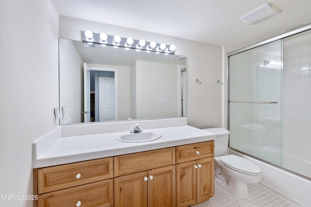 1314 Saint Gallen Ct, Incline Village, NV 89451 - bathroom featuring toilet, vanity, tile patterned flooring, and shower / bath combination with glass door
