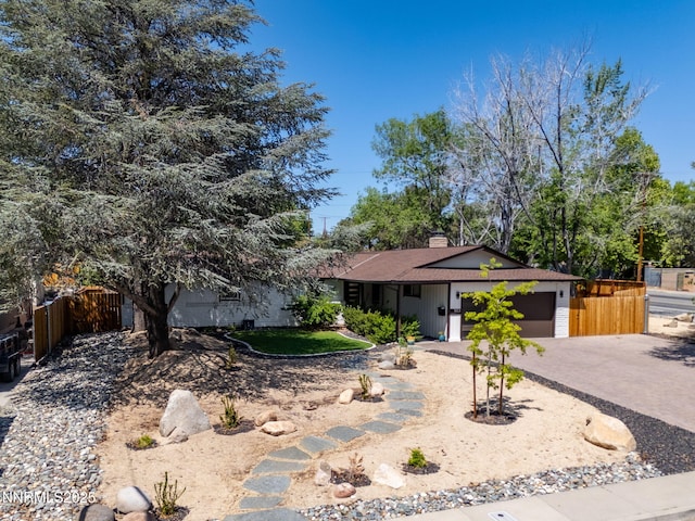 1901 S Marsh Ave, Reno, NV 89509 - view of front of property featuring driveway, an attached garage, and a chimney