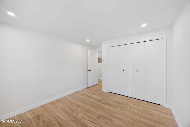 1901 S Marsh Ave, Reno, NV 89509 - unfurnished bedroom featuring light wood-style floors, recessed lighting, baseboards, and a closet