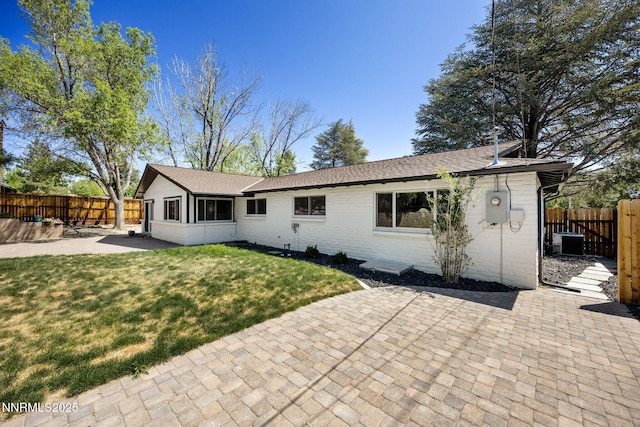 1901 S Marsh Ave, Reno, NV 89509 - rear view of property featuring a patio area, central AC, brick siding, and a shingled roof