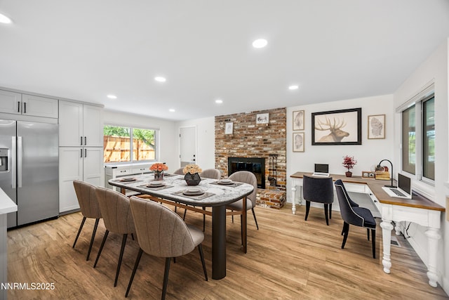1901 S Marsh Ave, Reno, NV 89509 - dining room featuring light wood-type flooring, a fireplace, recessed lighting, and an office area