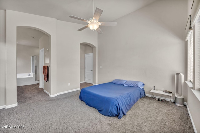 1771 Walnut Dr, Fernley, NV 89408 - bedroom featuring arched walkways, carpet floors, a ceiling fan, and ensuite bath