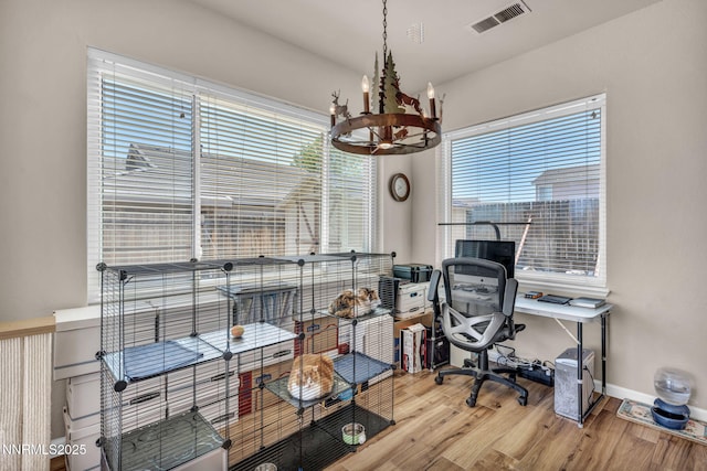 1771 Walnut Dr, Fernley, NV 89408 - home office with a chandelier and wood finished floors