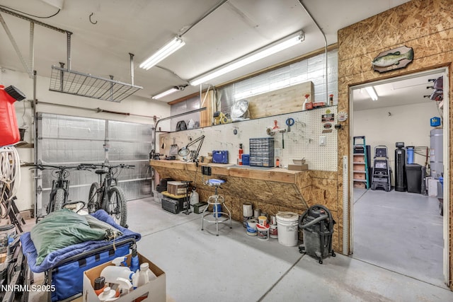 1771 Walnut Dr, Fernley, NV 89408 - garage with a workshop area and water heater