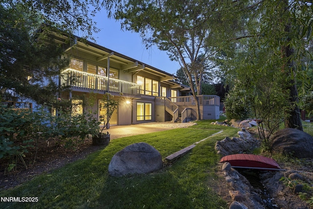 1405 Dartmouth Dr, Reno, NV 89509 - back of house featuring a yard, a patio, and stairs