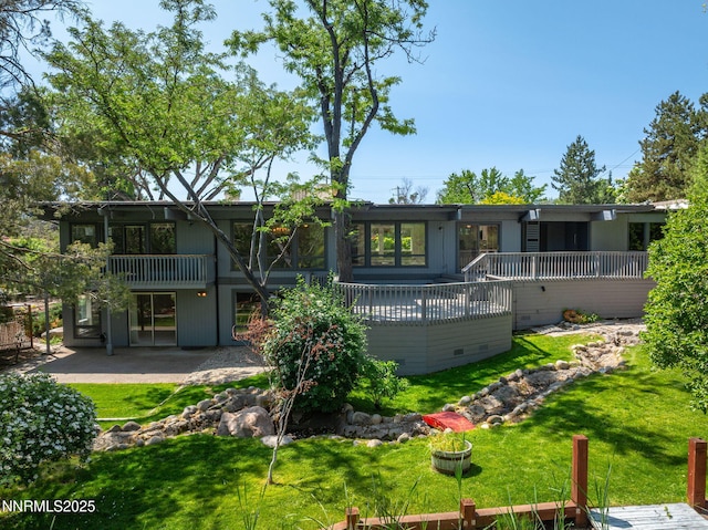 1405 Dartmouth Dr, Reno, NV 89509 - back of house featuring a lawn, crawl space, a patio area, and a deck