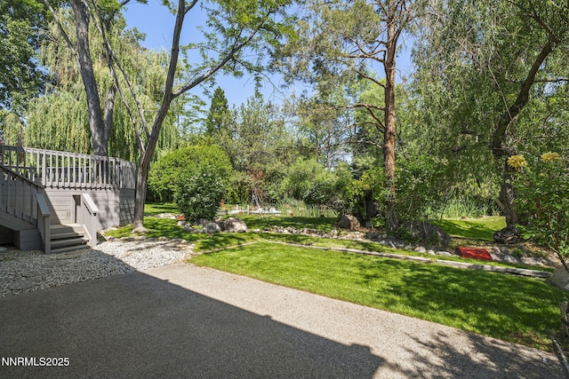 1405 Dartmouth Dr, Reno, NV 89509 - view of grassy yard featuring stairway and a wooden deck