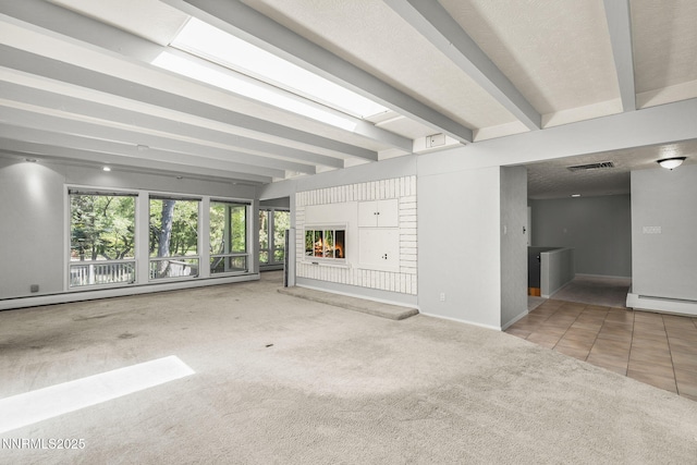 1405 Dartmouth Dr, Reno, NV 89509 - unfurnished living room featuring carpet flooring, beam ceiling, plenty of natural light, baseboards, and a fireplace