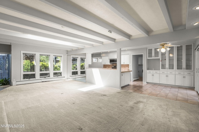 1405 Dartmouth Dr, Reno, NV 89509 - unfurnished living room featuring a baseboard radiator, light carpet, beam ceiling, light tile patterned floors, and recessed lighting
