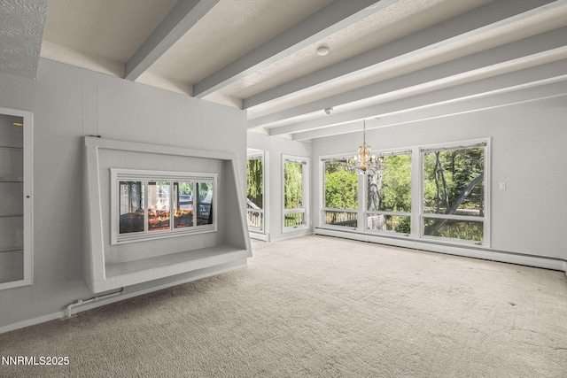 1405 Dartmouth Dr, Reno, NV 89509 - unfurnished living room featuring carpet, a baseboard radiator, beamed ceiling, and plenty of natural light