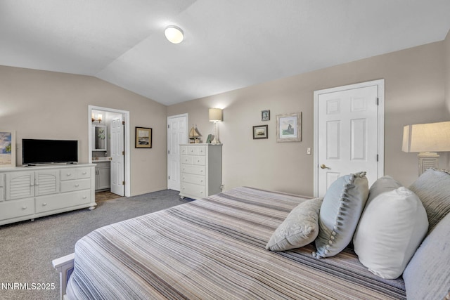 1416 Sally Ln, Gardnerville, NV 89460 - carpeted bedroom featuring lofted ceiling, ensuite bathroom, and baseboards