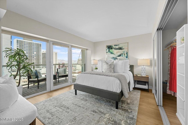 255 N Sierra St Unit 1410, Reno, NV 89501 - bedroom featuring access to exterior and light wood-style floors