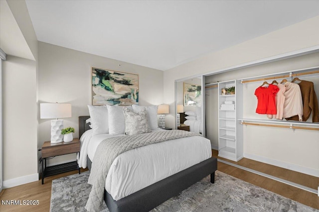 255 N Sierra St Unit 1410, Reno, NV 89501 - bedroom featuring wood finished floors and baseboards