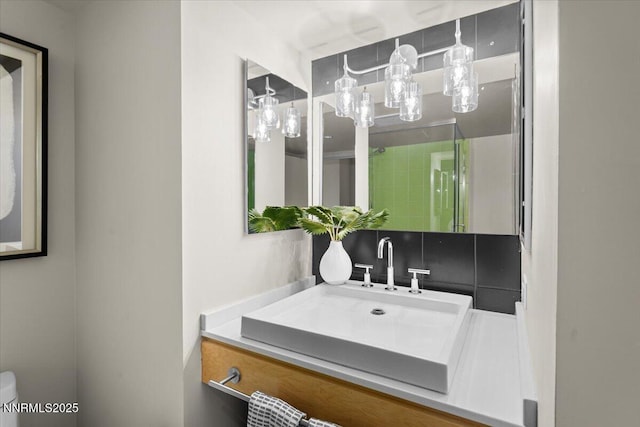 255 N Sierra St Unit 1410, Reno, NV 89501 - bathroom featuring vanity, a shower with door, and toilet