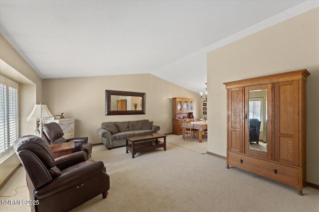 4492 Trenton Ct, Sparks, NV 89436 - living room with light carpet, a chandelier, and vaulted ceiling