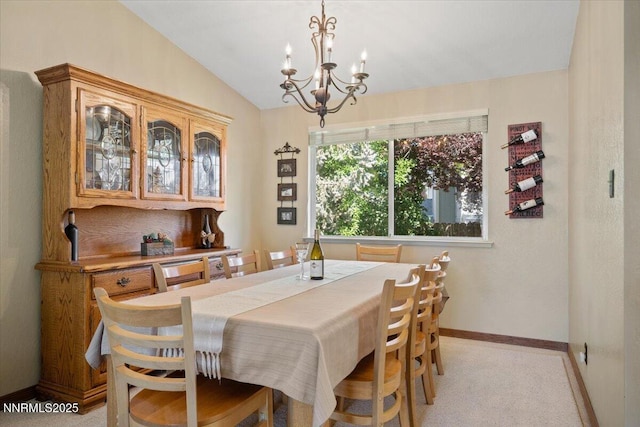 4492 Trenton Ct, Sparks, NV 89436 - dining area featuring a chandelier, lofted ceiling, and light colored carpet