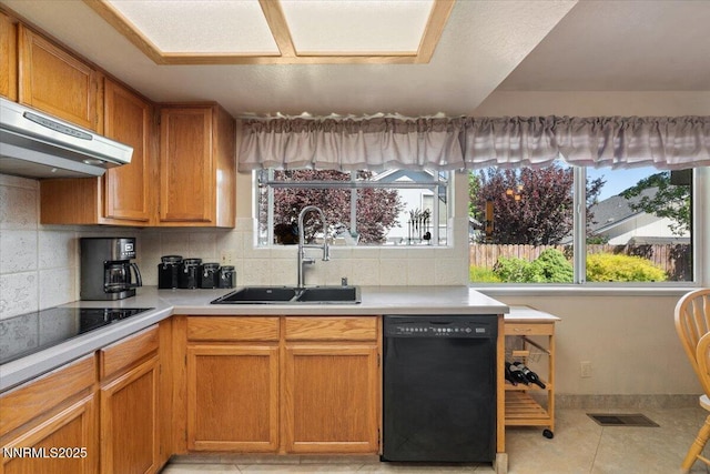 4492 Trenton Ct, Sparks, NV 89436 - kitchen featuring black appliances, decorative backsplash, light countertops, ventilation hood, and light tile patterned floors